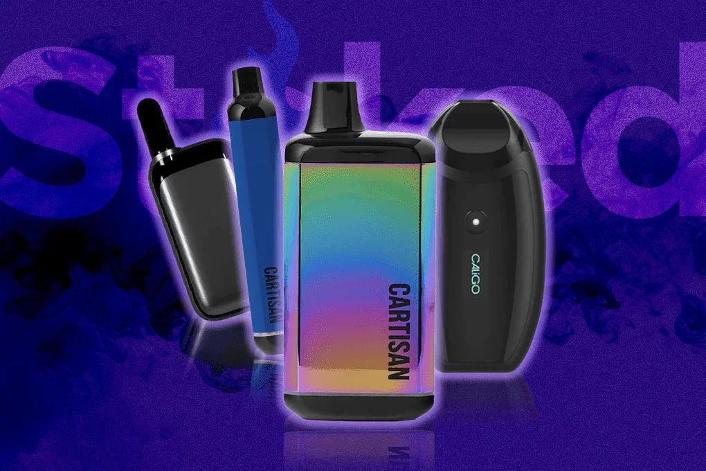 Colorful portable vaporizers and vape pens on a purple smoky background, labeled Cartisan and Caligo.