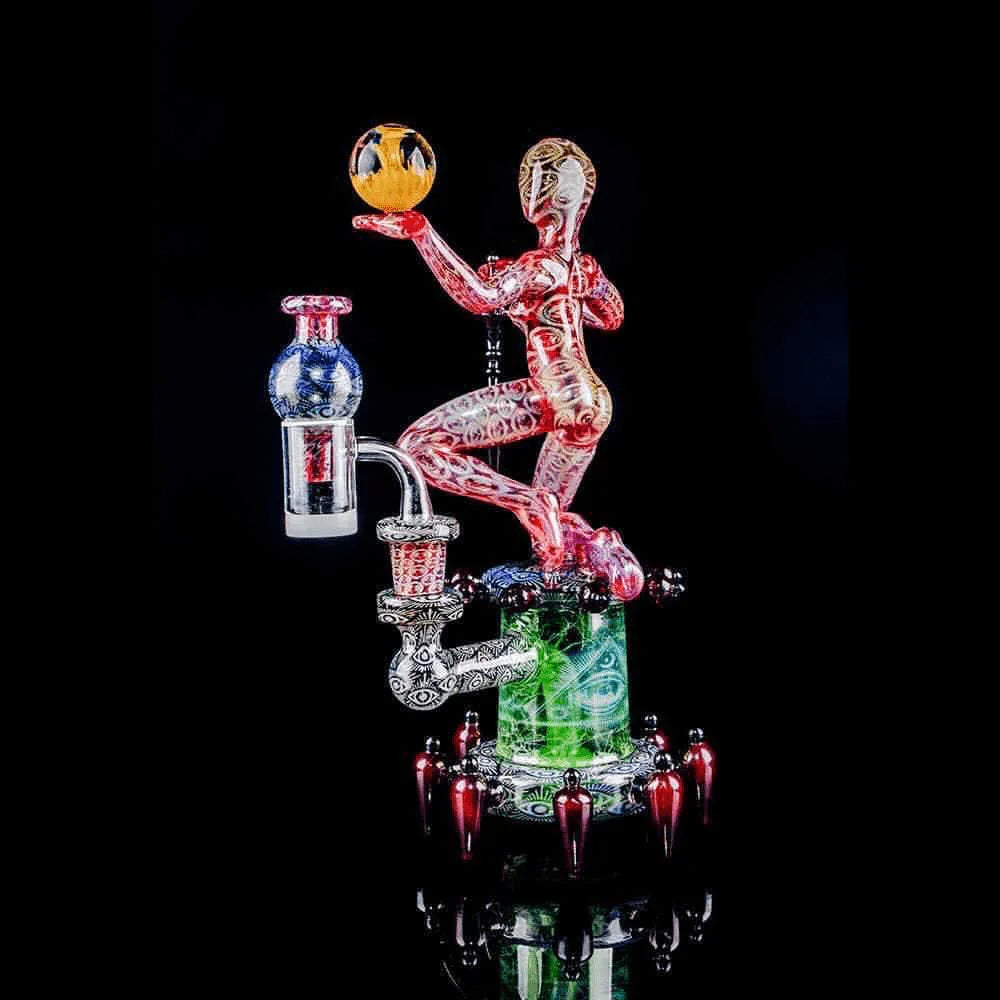 Intricate heady glass water pipe shaped like a human figure holding a glass orb, futuristic design