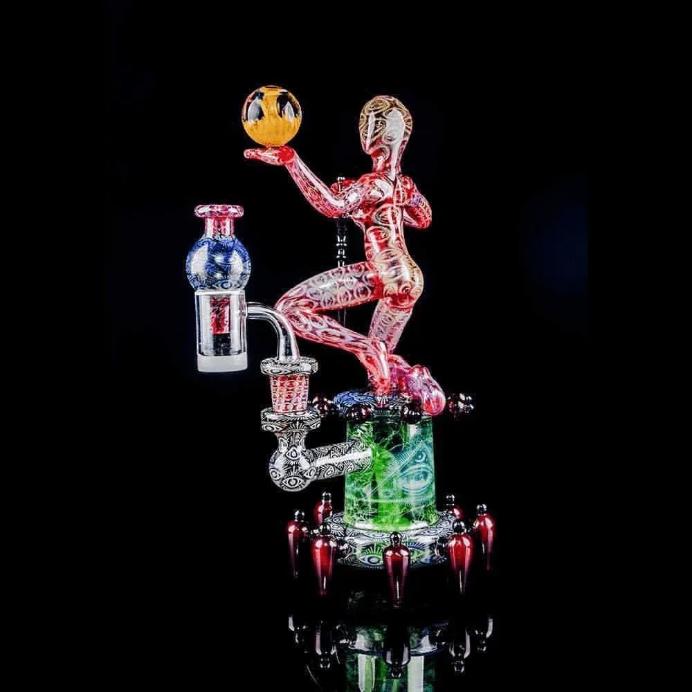 Intricate heady glass water pipe shaped like a human figure holding a glass orb, futuristic design
