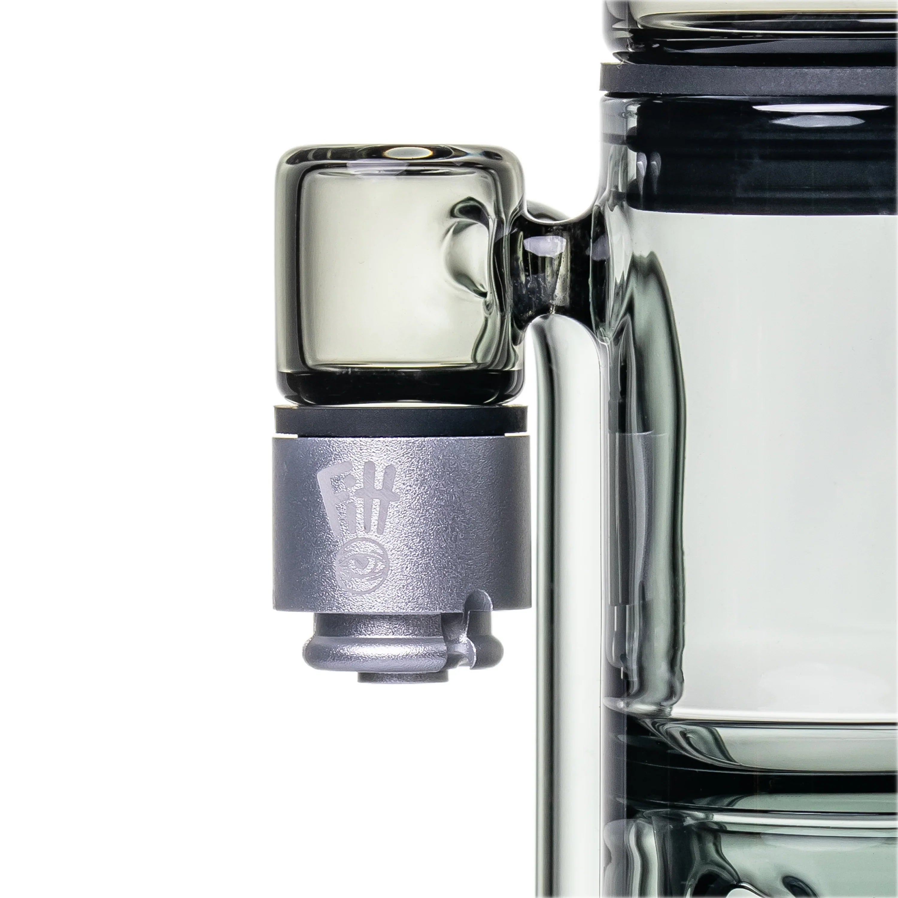 Close-up of a glass rig with a metal banger attachment for concentrates and vaporizer use