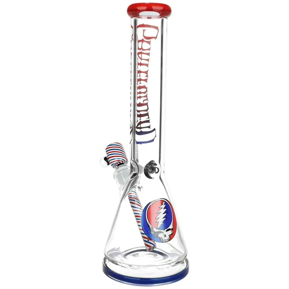 Clear glass beaker bong with red and blue accents, Grateful Dead logo, and striped bowl piece