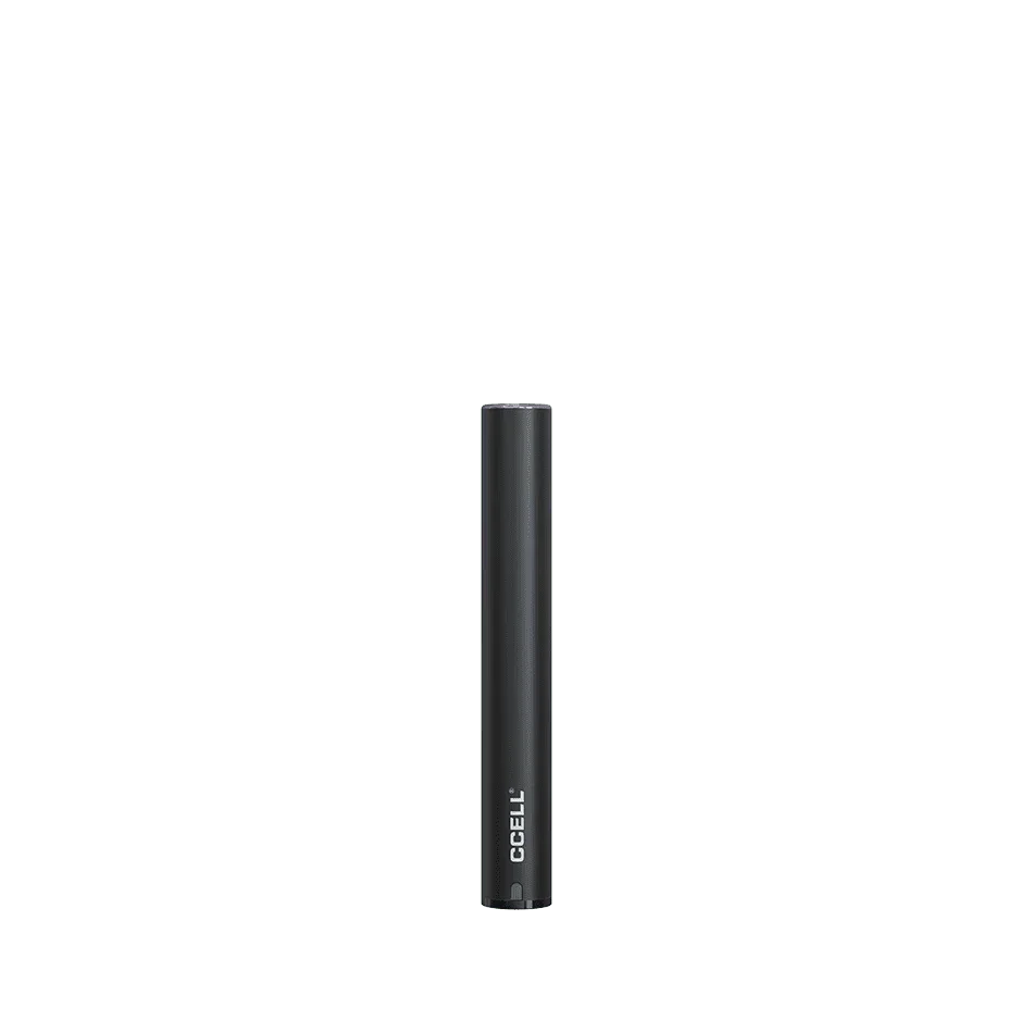 Black CCELL vape pen battery standing upright on a plain green background