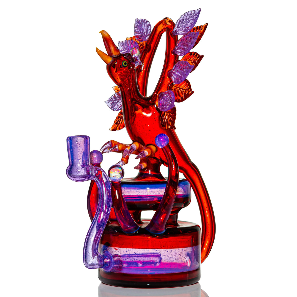 Hand-blown glass dab rig with a phoenix design by Burtoni