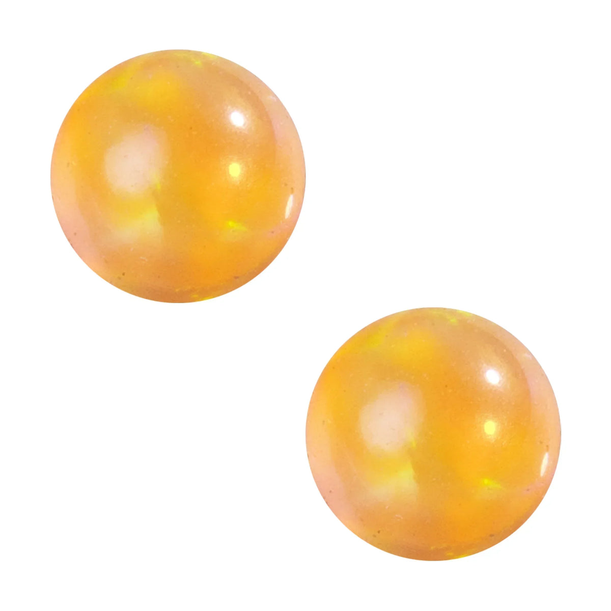 Two iridescent yellow glass terp pearls on white background