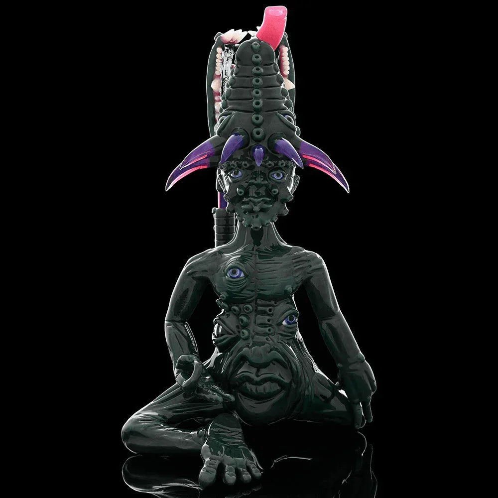 Intricately detailed heady glass art sculpture shaped like a fantasy creature with multiple eyes and horns, displayed on a black background.