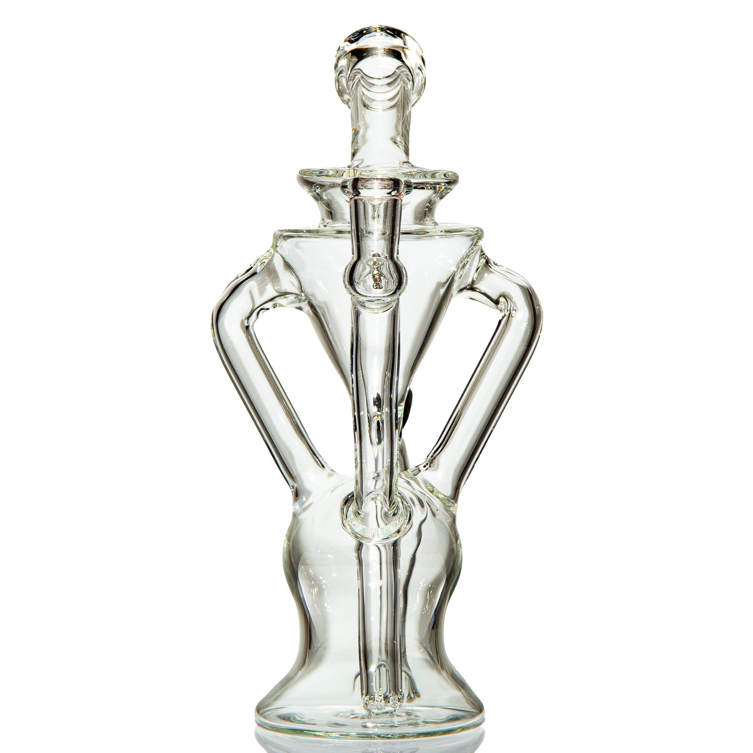 Clear artistic glass water pipe with unique sculpted design on white background.