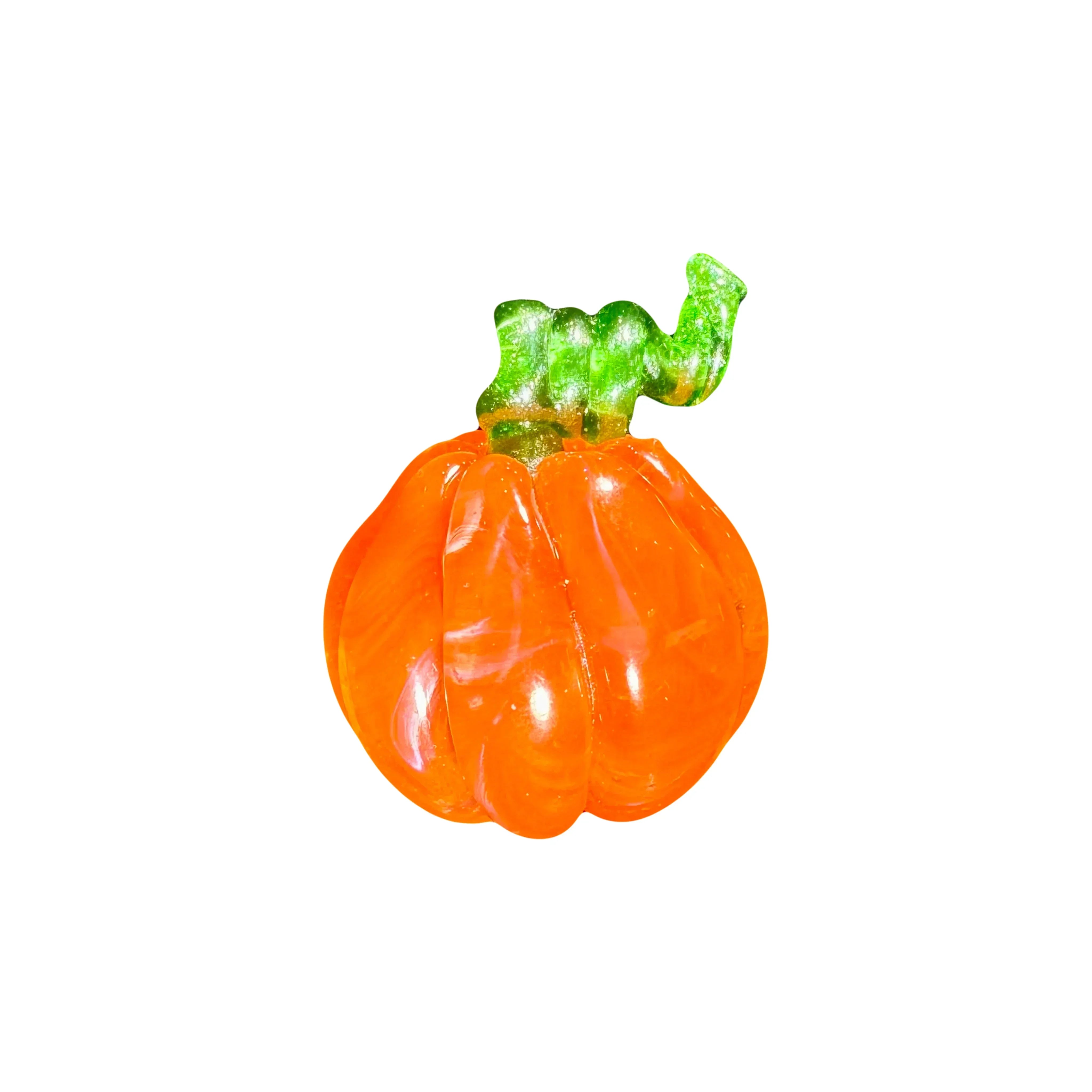 handcrafted glass pumpkin with orange body and green stem on white background