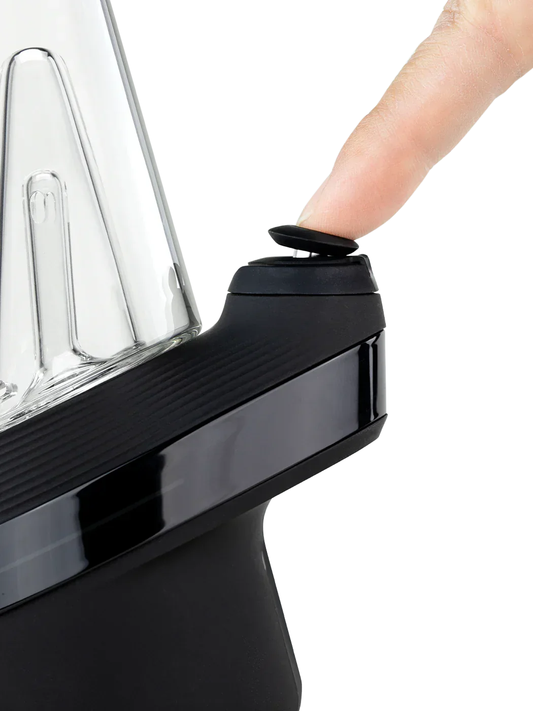 Finger pressing power button on modern glass vaporizer with black base