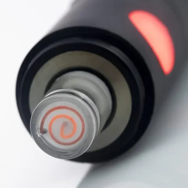 Close-up of a glass vaporizer heating element with visible coil and glowing light