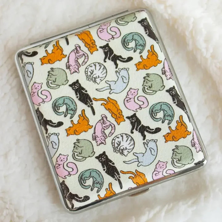 Case with multicolored cat pattern on white textured fabric, decorative storage accessory