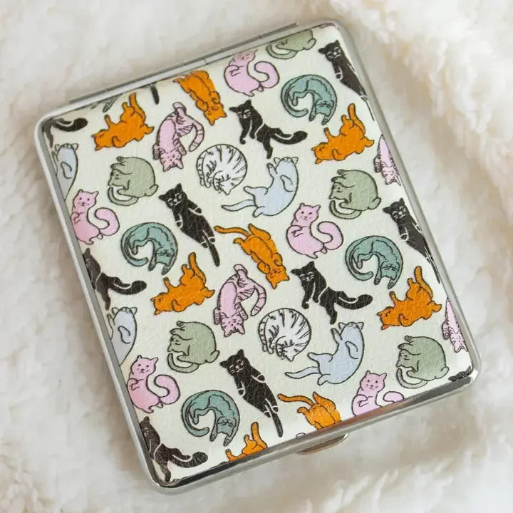 Case with multicolored cat pattern on white textured fabric, decorative storage accessory