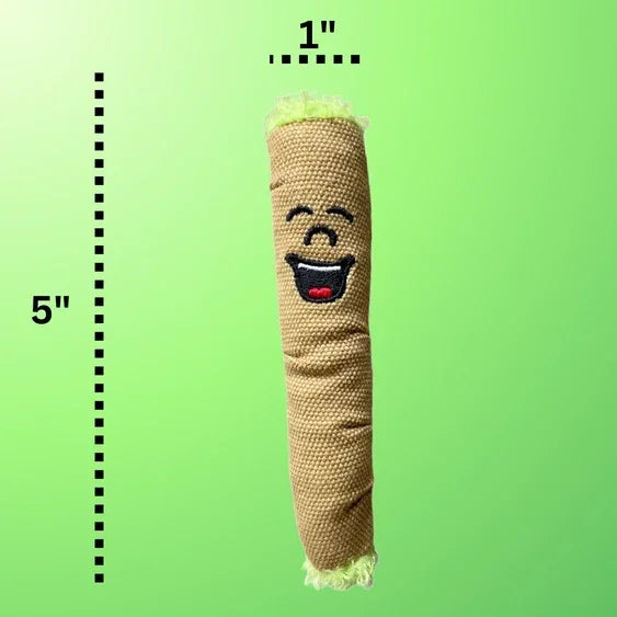 Smiling plush toy shaped like a brown rolled stick, 5 inches tall, on green background
