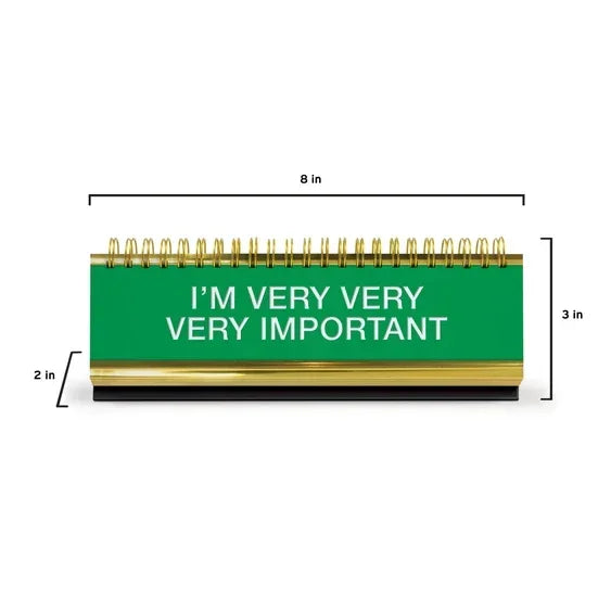Green desk nameplate with gold trim, spiral bound, text says 'I’m very very very important', dimensions 8x3x2 in