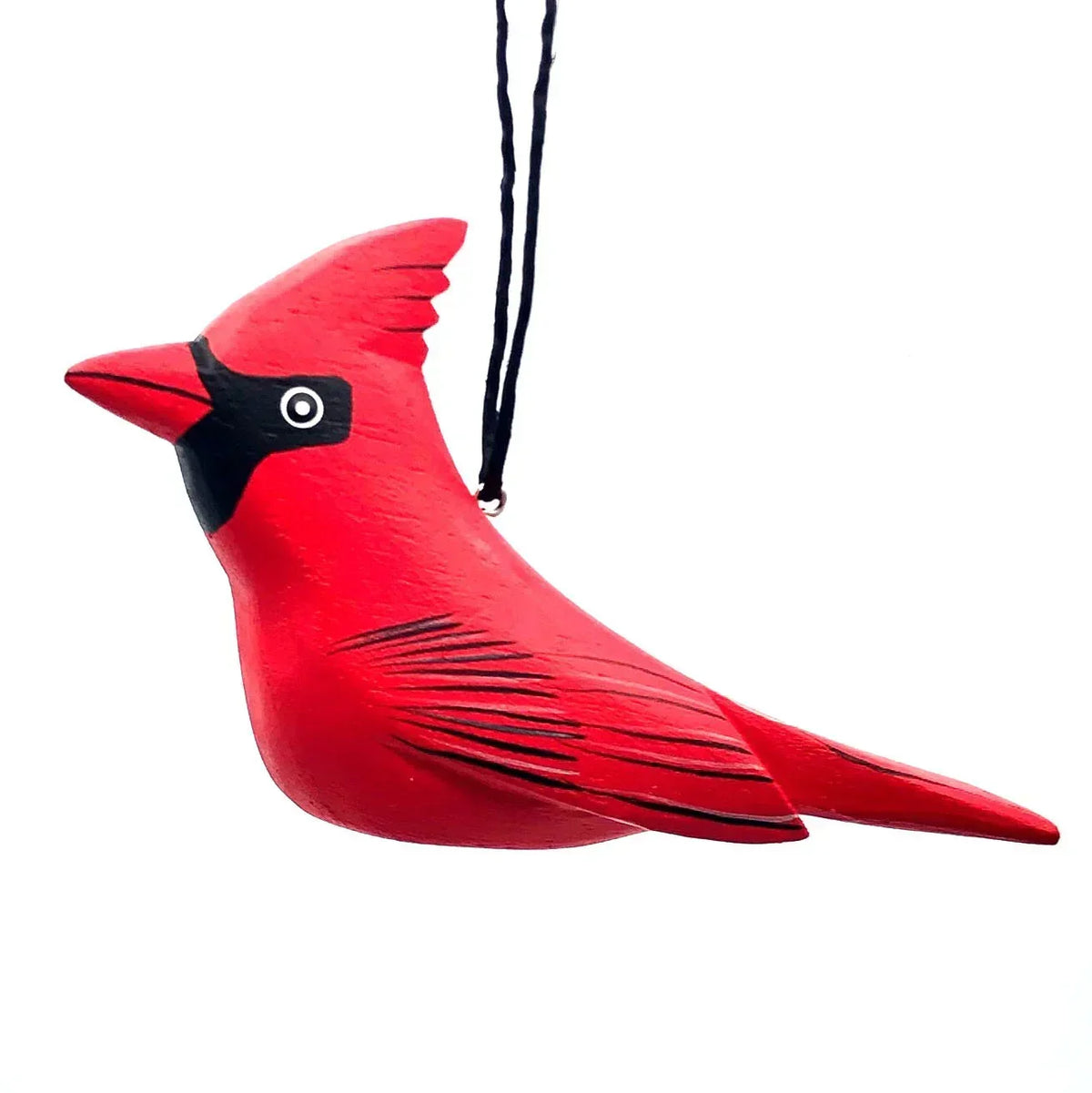 Red cardinal bird ornament with black facial markings, hanging on black string