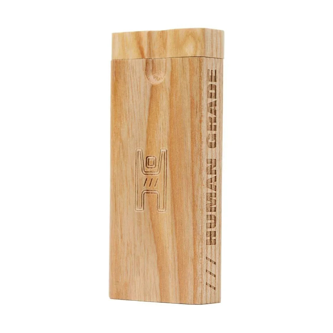Light wood dugout box with engraved figure and 'HUMAN GRADE' text for smoking accessories