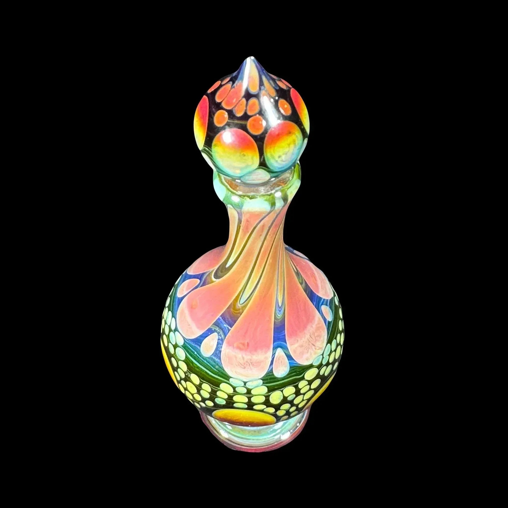 Colorful heady glass art piece with intricate designs on a black background