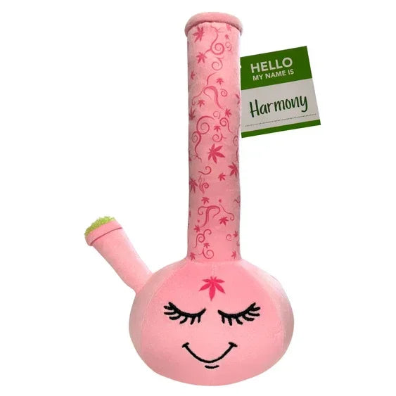 Pink plush bong toy with embroidered smiling face and floral designs, tag reads 'Harmony'.