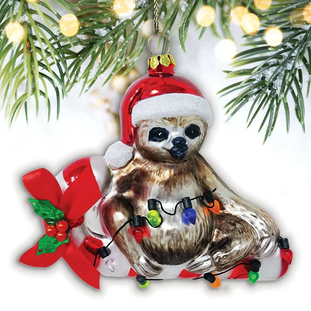 Sloth Christmas tree ornament with Santa hat, festive lights, and red ribbon