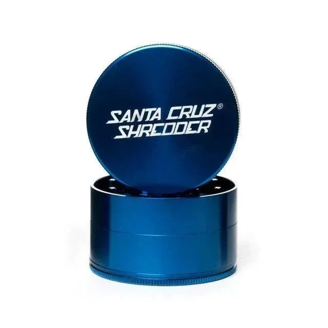 Large blue four-piece Santa Cruz herb grinder with lid open on white background