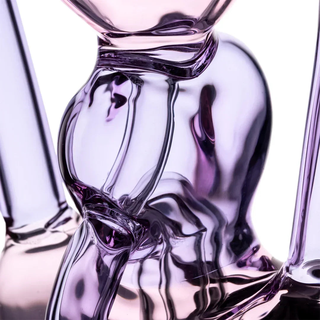 Close-up of a sculpted purple glass water pipe with smooth curves and reflective surface