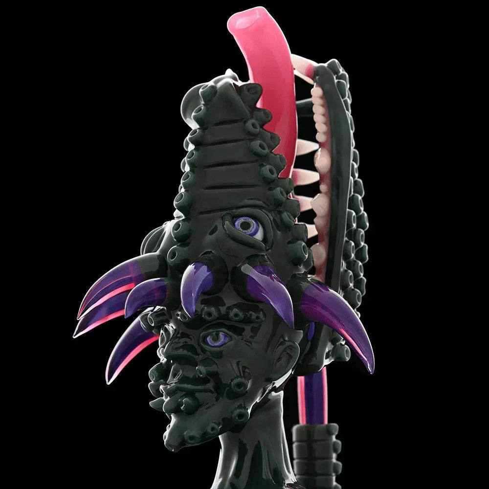 Unique heady glass art piece with purple claws, eyes, and sculpted monster features