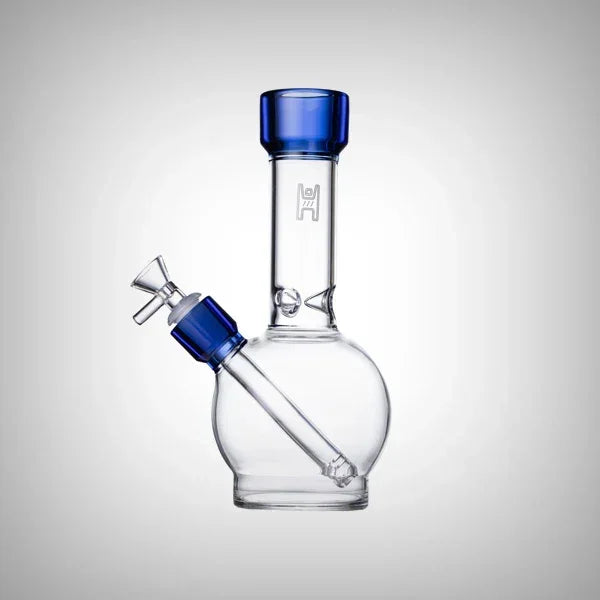 Clear glass water pipe with blue accents and rounded base on white background