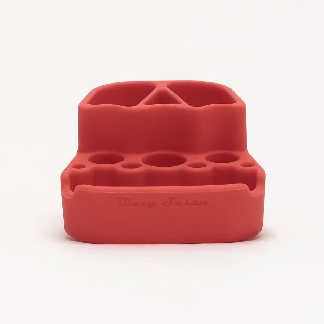 Red silicone smoking accessory organizer with multiple slots, Blazy Susan text on front.