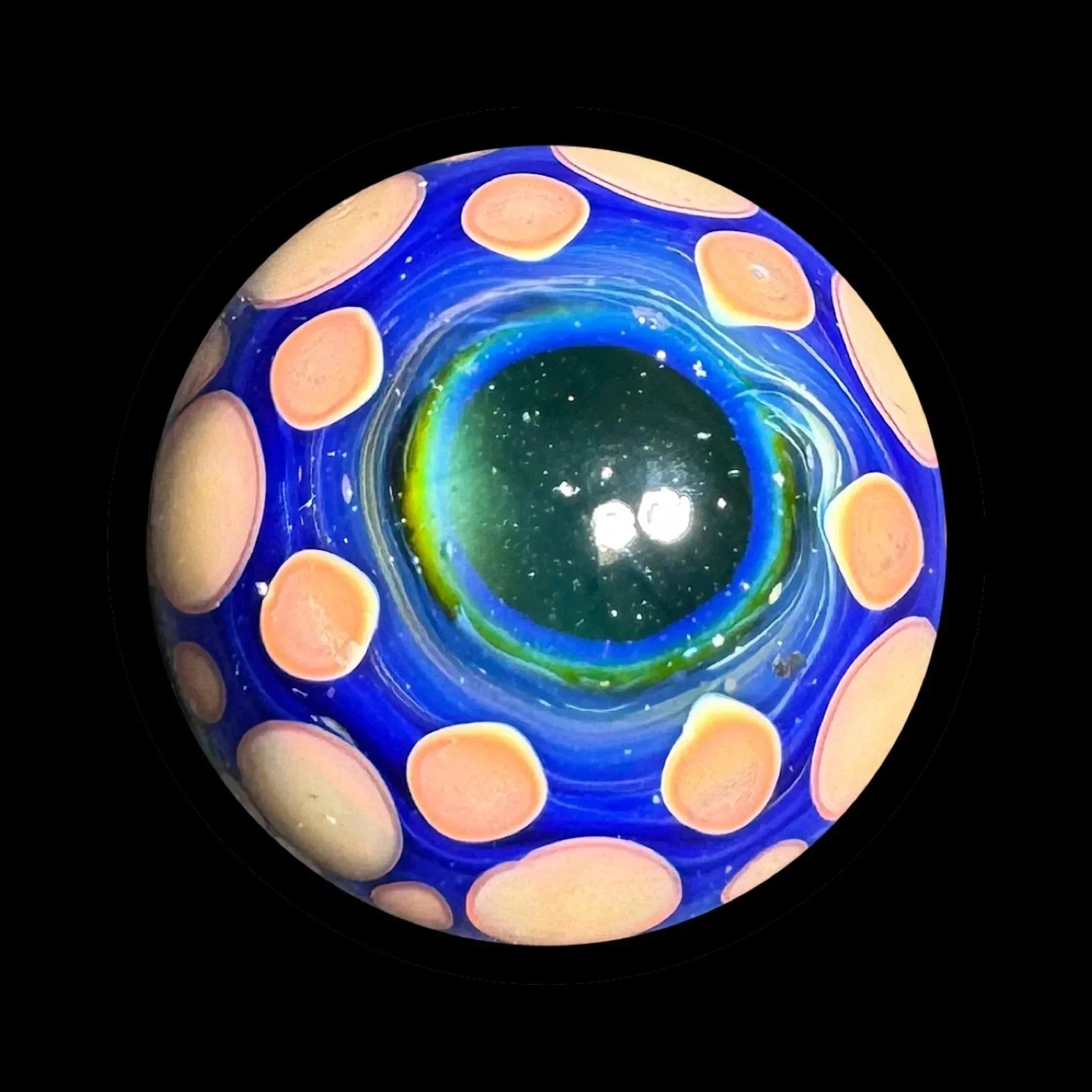 Handcrafted blue glass marble with pink polka dots and green center, art glass accessory