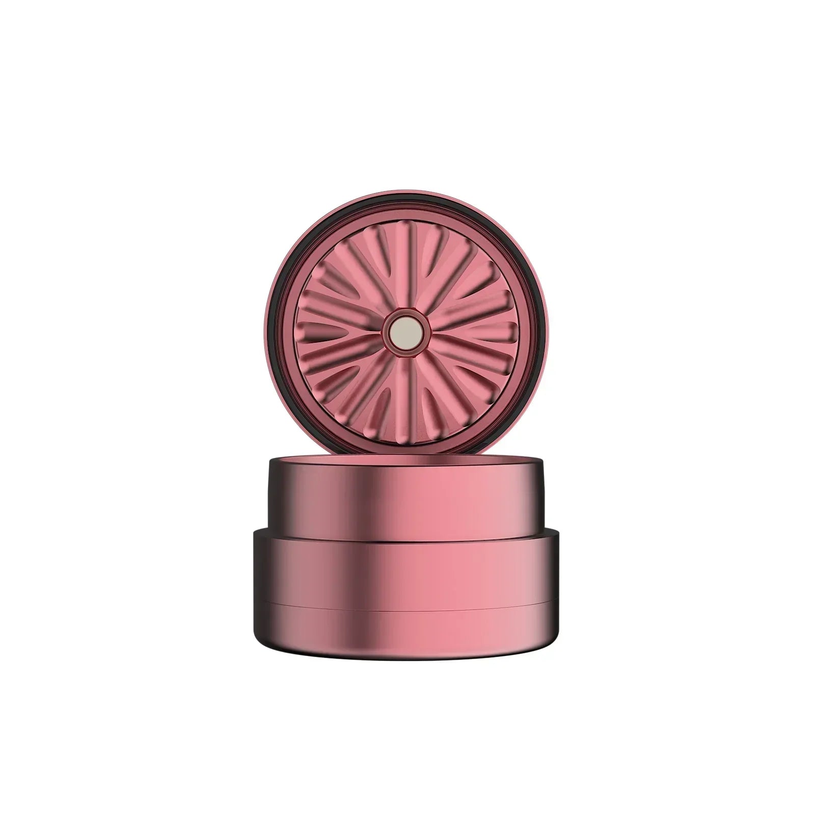 Rose gold metal herb grinder with magnetic lid and precision-cut teeth, isolated on white