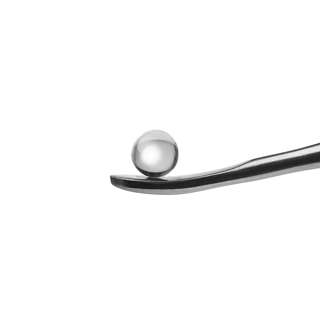 Stainless steel dab tool holding a metal terp pearl for vaporizer accessories