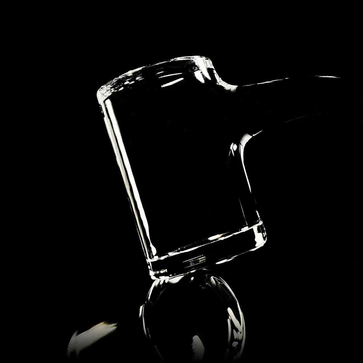 Clear quartz banger for dab rig, glass accessory on black background