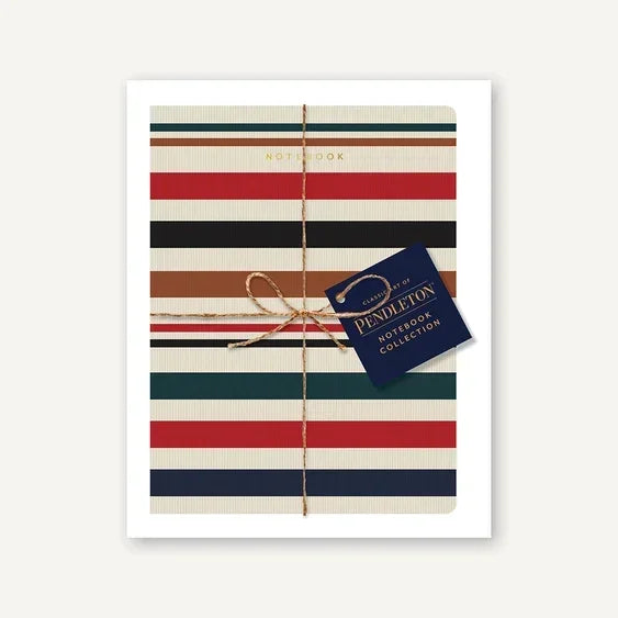 Striped notebook with red, navy, green, and tan lines, wrapped in twine with a Pendleton tag.