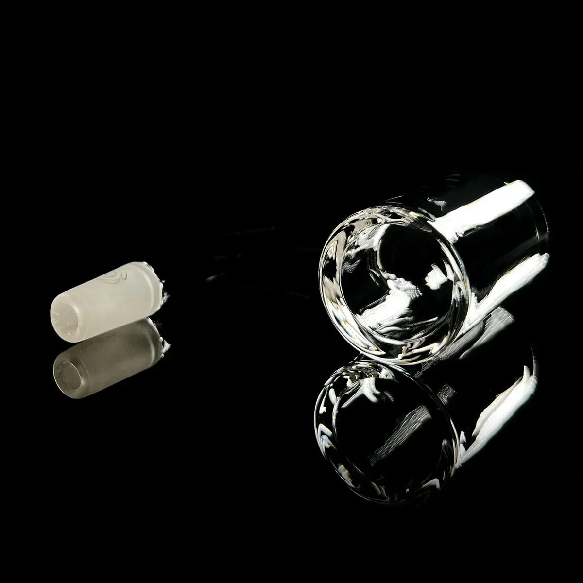 Quartz banger and frosted glass insert on black background, smoking accessory