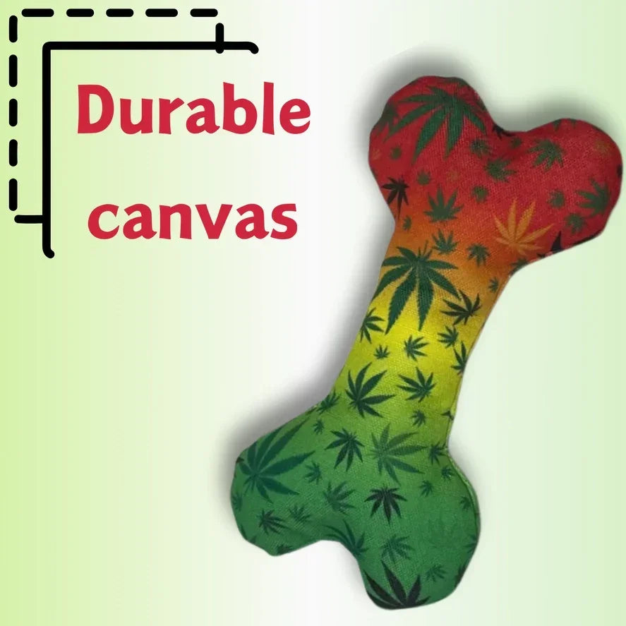 Durable canvas dog bone toy with rasta colors and leaf pattern on light background