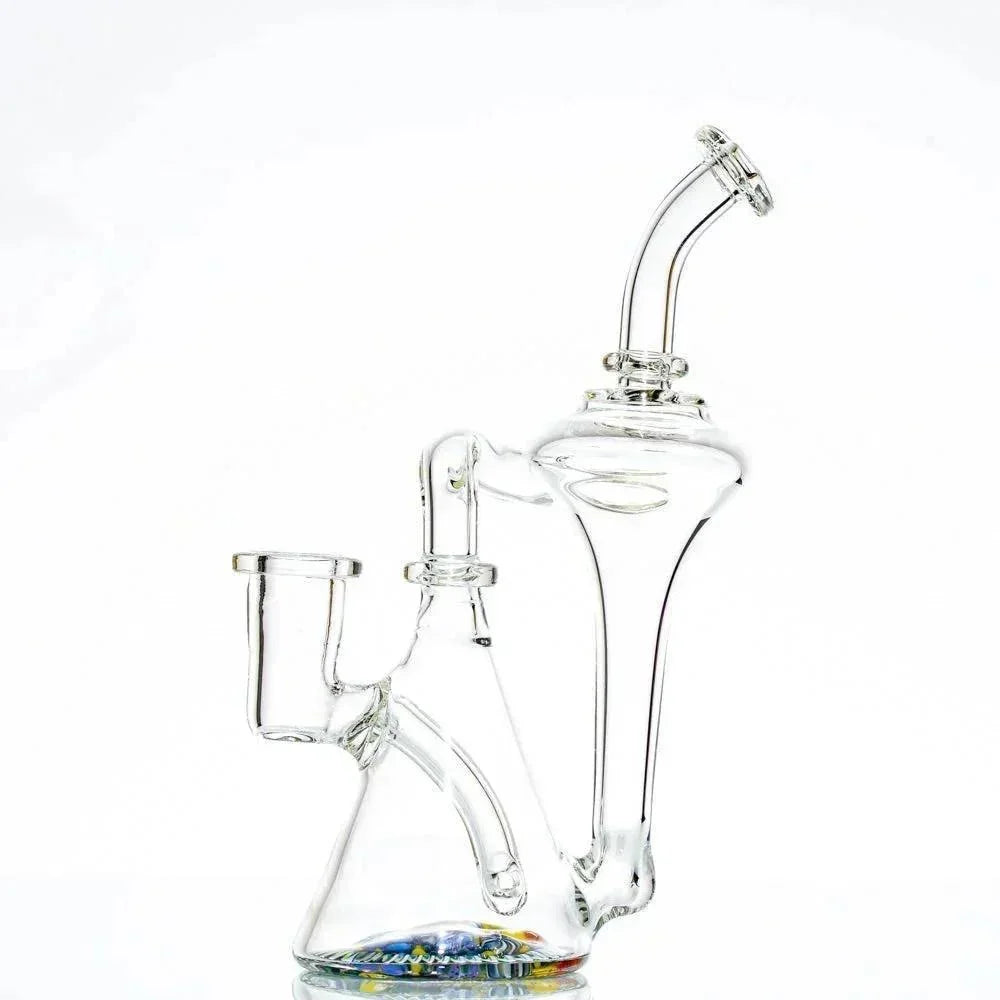 Clear glass recycler water pipe with unique curved design and colorful marbles at base
