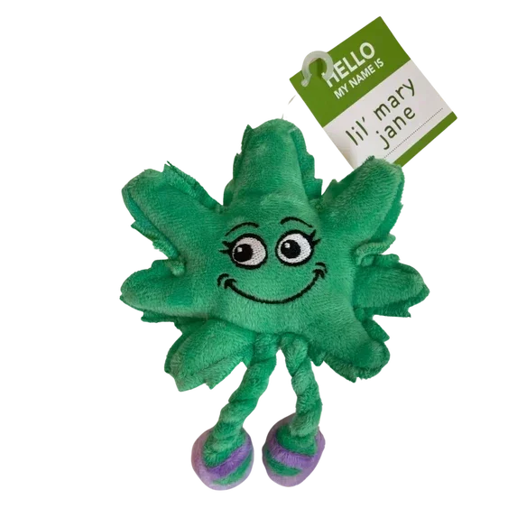 Plush green leaf toy with smiling face, dangling legs, and a tag reading 'lil' mary jane'