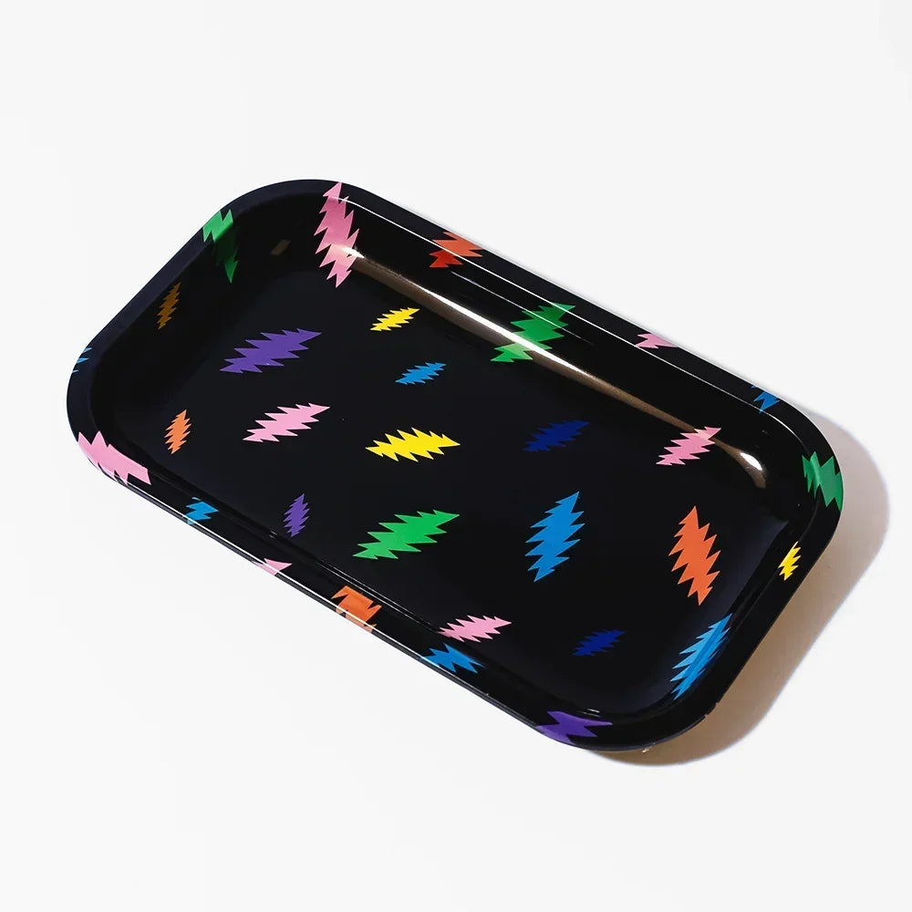 Black metal rolling tray with colorful lightning bolt pattern, photographed on white background