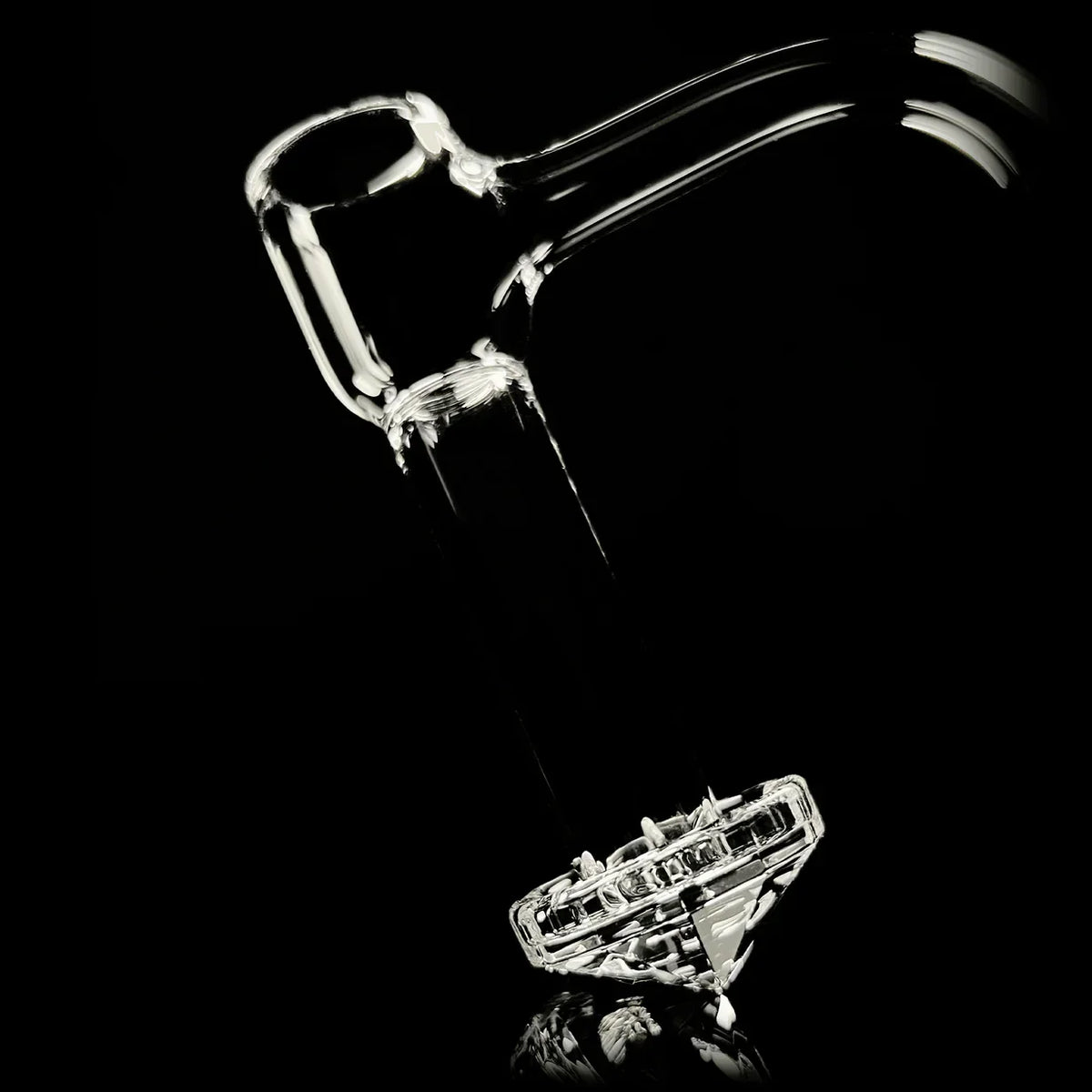 Clear quartz glass banger with diamond cut base on black background