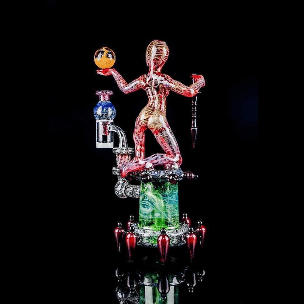 Artistic heady glass water pipe featuring a colorful human figure design on black background