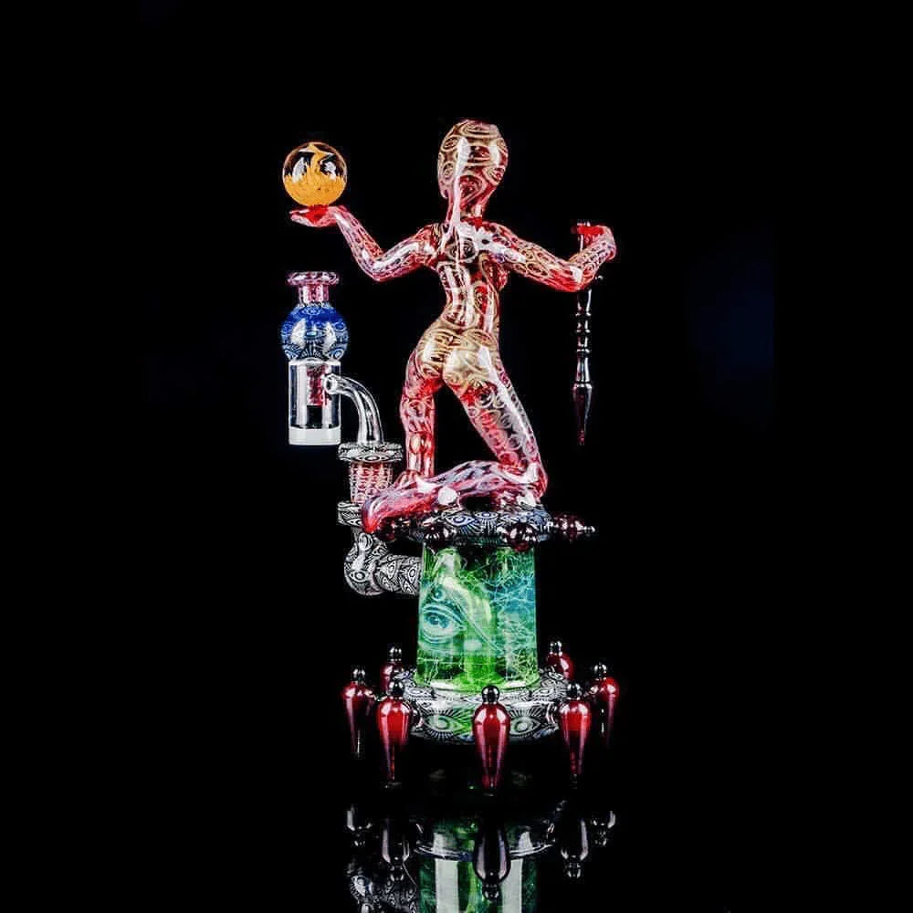 Artistic heady glass water pipe featuring a colorful human figure design on black background
