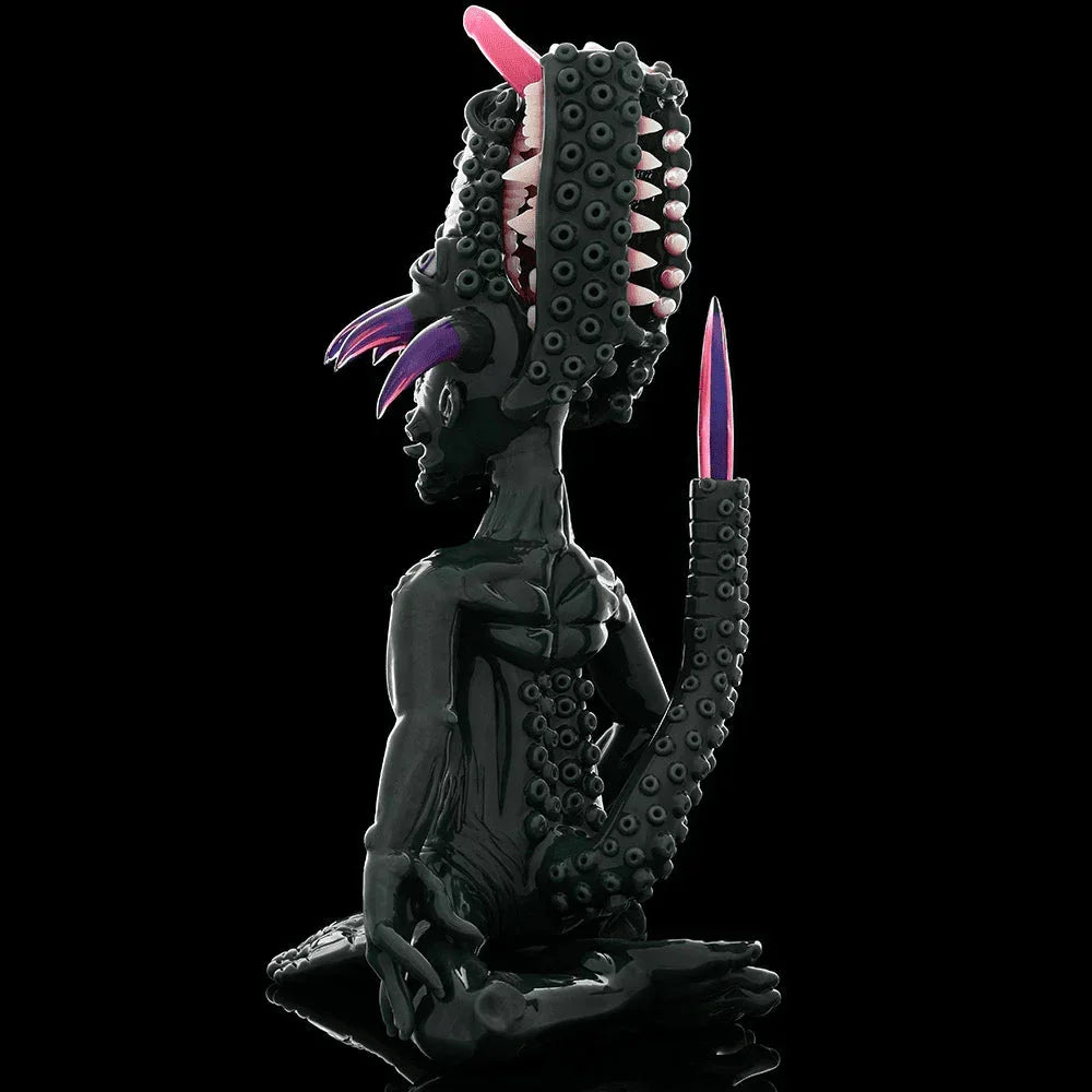 Heady glass sculpture with tentacles, teeth, and vibrant purple accents on black background