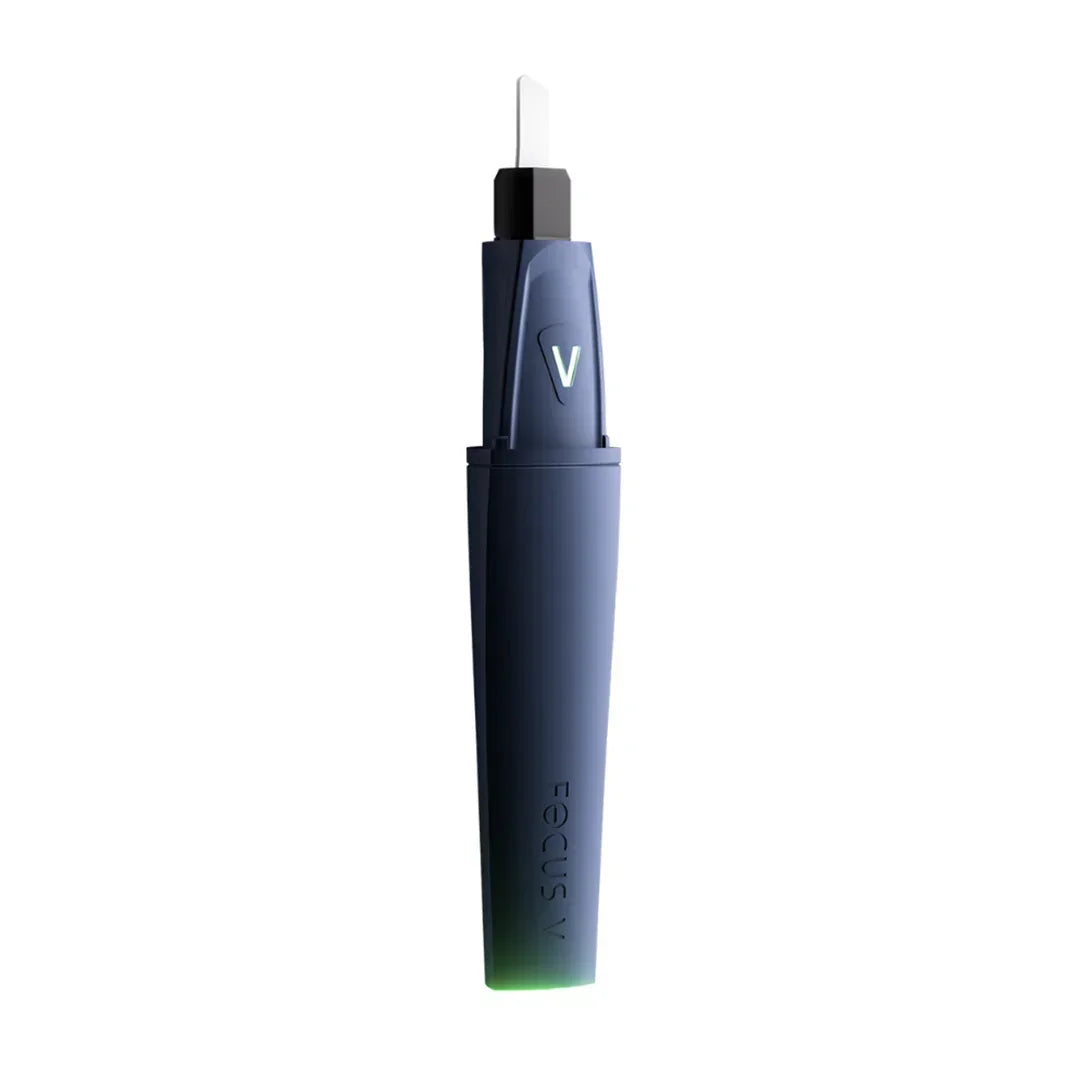 Focus V electronic dab tool in dark blue with glowing tip on white background