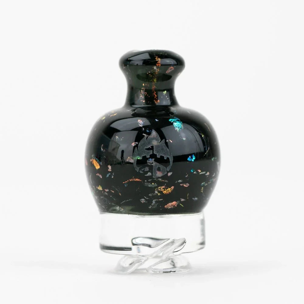 Black glass carb cap with iridescent flakes and clear base, for dab rigs or vaporizers.
