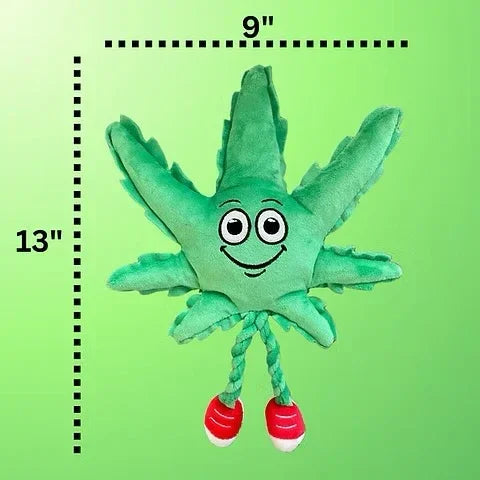 Plush green leaf toy with smiling face, red sneakers, 13 inches tall by 9 inches wide, on green background