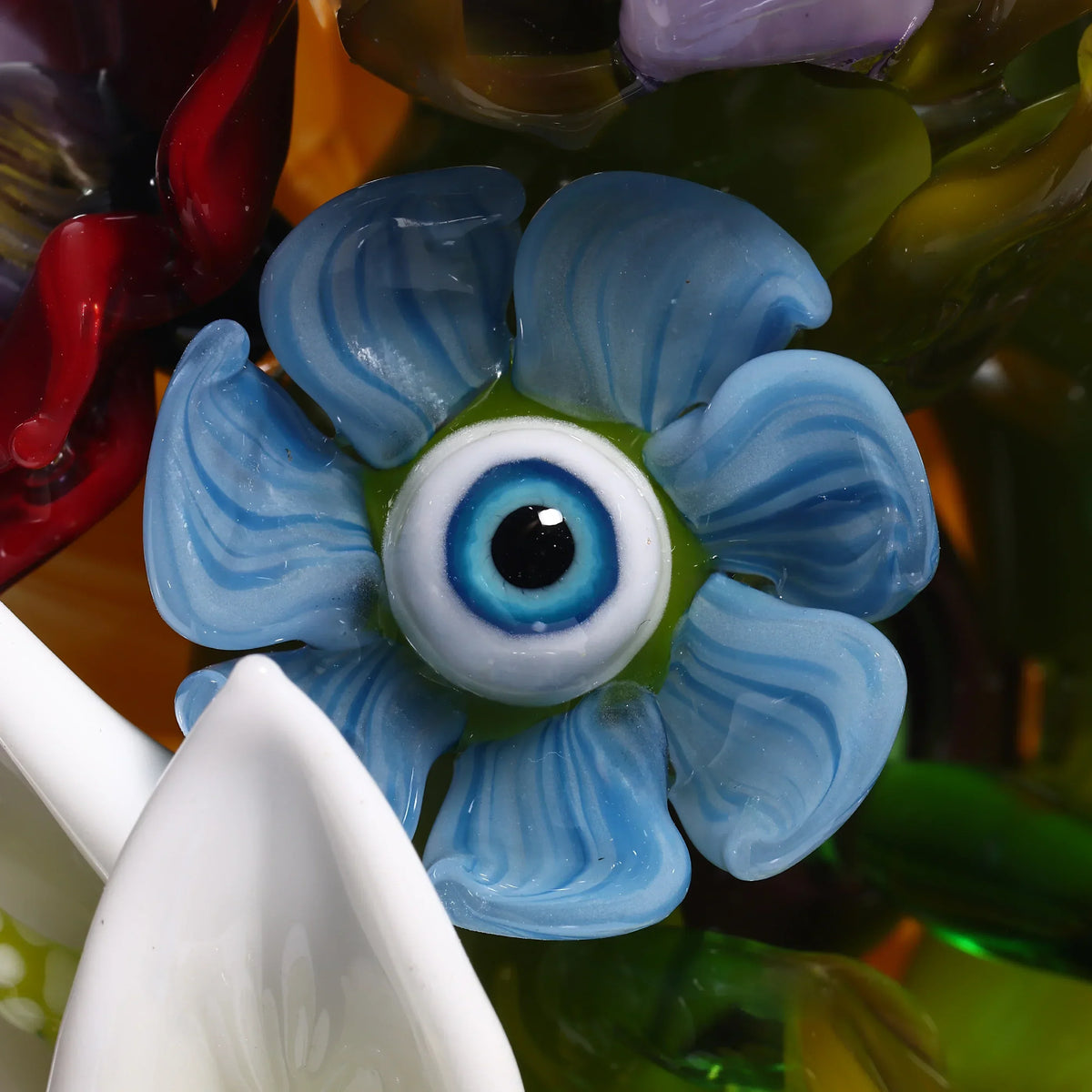 Blue glass flower with an eyeball center, artistic heady glass art detail