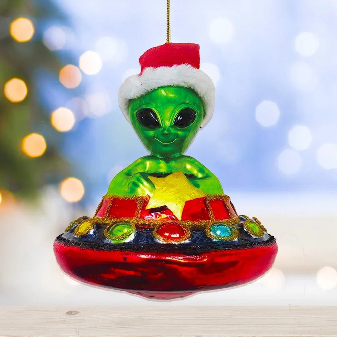 Alien Christmas ornament wearing Santa hat in colorful UFO with festive lights