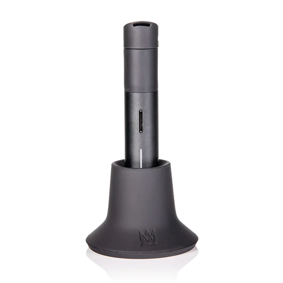 Black vaporizer device with charging dock, modern smoke shop accessory on white background