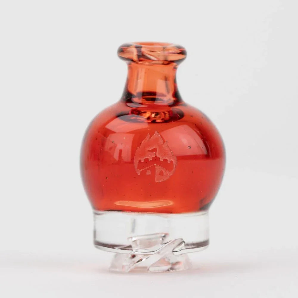 Red glass carb cap with flame logo for dab rigs or vaporizers on white background