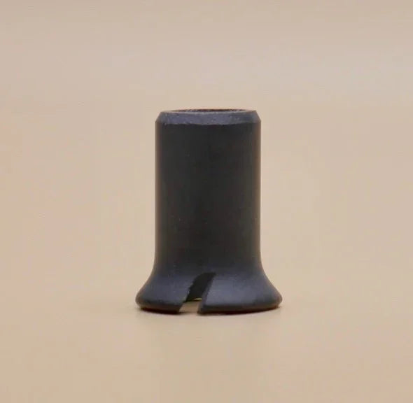 Black ceramic vaporizer accessory with slotted base on a neutral background
