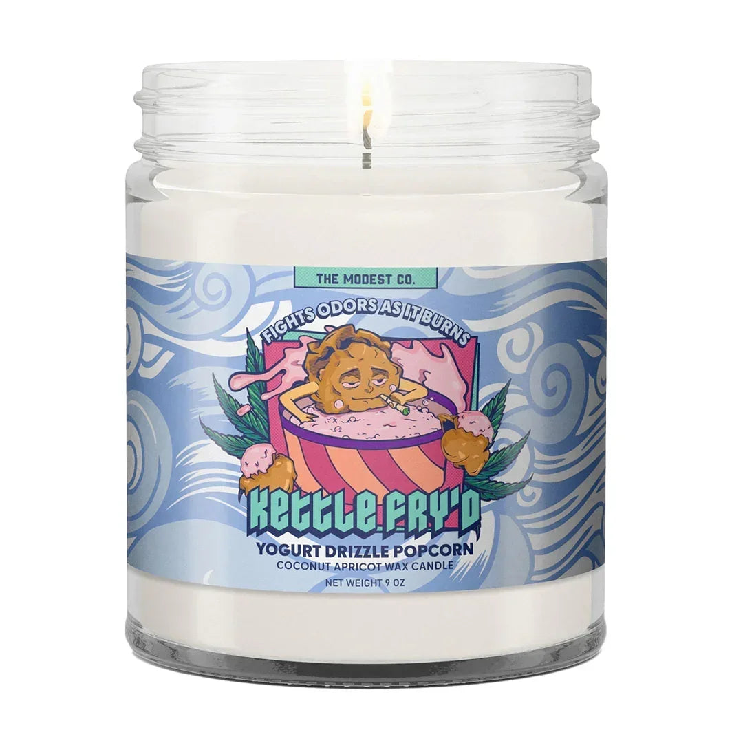 Kettle Fry'd yogurt drizzle popcorn scented candle in glass jar with colorful label lit